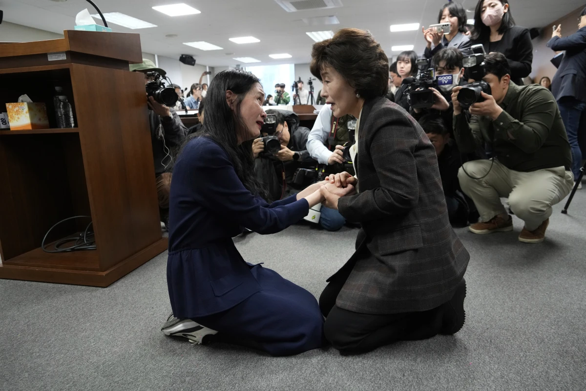 Truth and Reconciliation Commission Chairperson Park Sun Young (right) comforts adoptee Yooree Kim during a press conference in Seoul, South Korea, on March 26. Before the 1990s, South Korea was the top country for international adoptions to the U.S. A 2000 U.S. law's age cutoff makes the issue of adoptees without citizenship especially pertinent to those from South Korea.