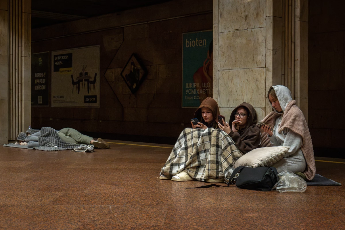 People rest in a metro station, being used as a bomb shelter, during a Russian drones attack in Kyiv, Ukraine, early Friday.