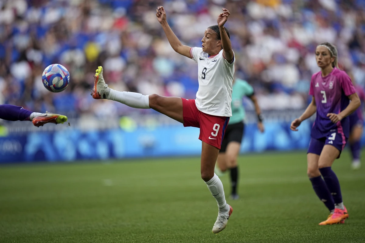 The U.S. women's soccer team defeated Germany 1-0 to advance to its first gold medal match at the Olympics since 2012. The U.S. team's Mallory Swanson fights for the ball during the semifinal match on Tuesday at Lyon Stadium in Decines, France.
