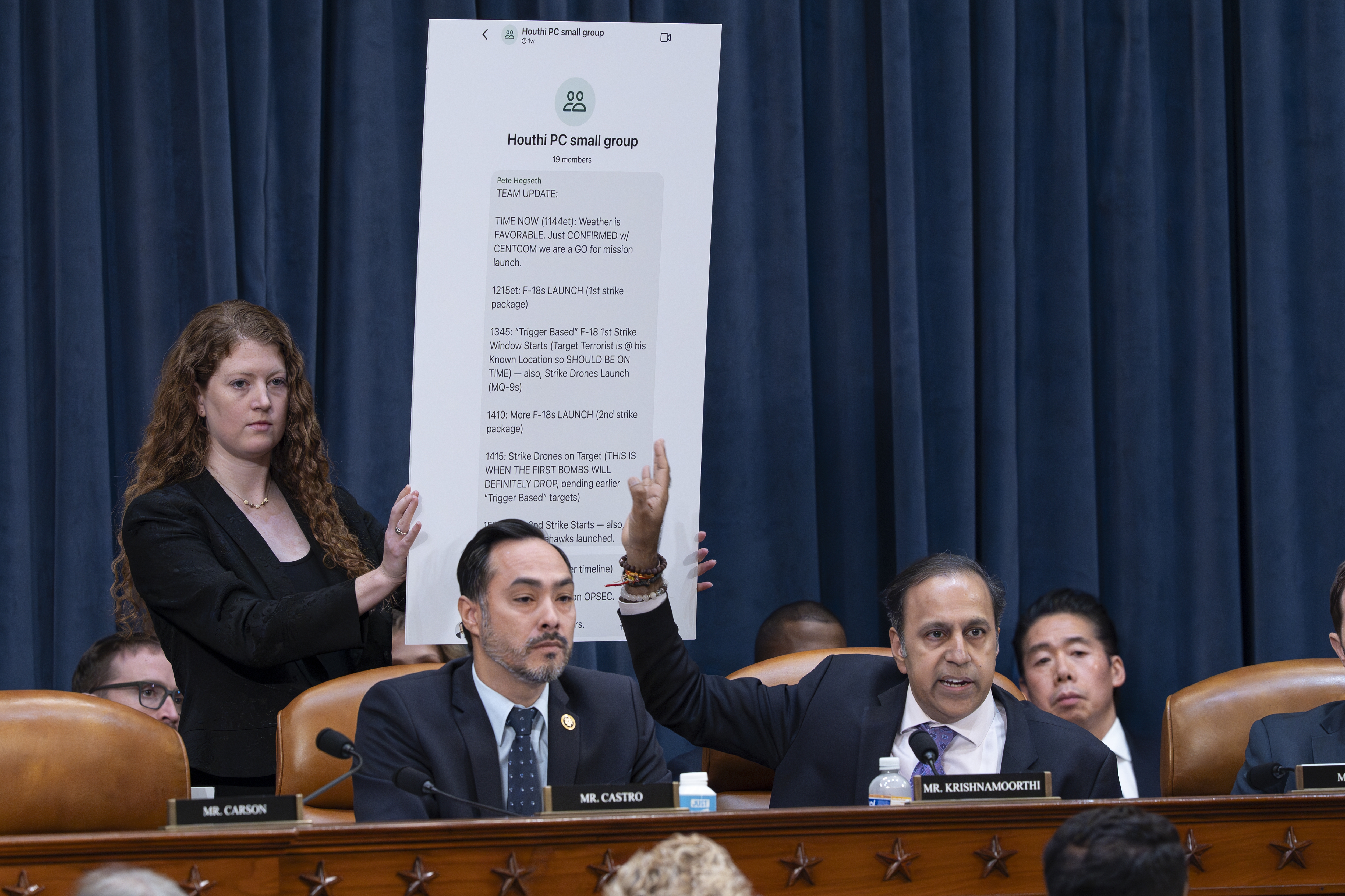Rep. Raja Krishnamoorthi, D-Ill., (right), joined by Rep. Joaquin Castro, D-Texas, points to a chart displaying a text message by Defense Secretary Pete Hegseth in a group chat that revealed U.S. military plans in Yemen to a journalist, at a House Intelligence Committee hearing Wednesday in Washington. (AP)