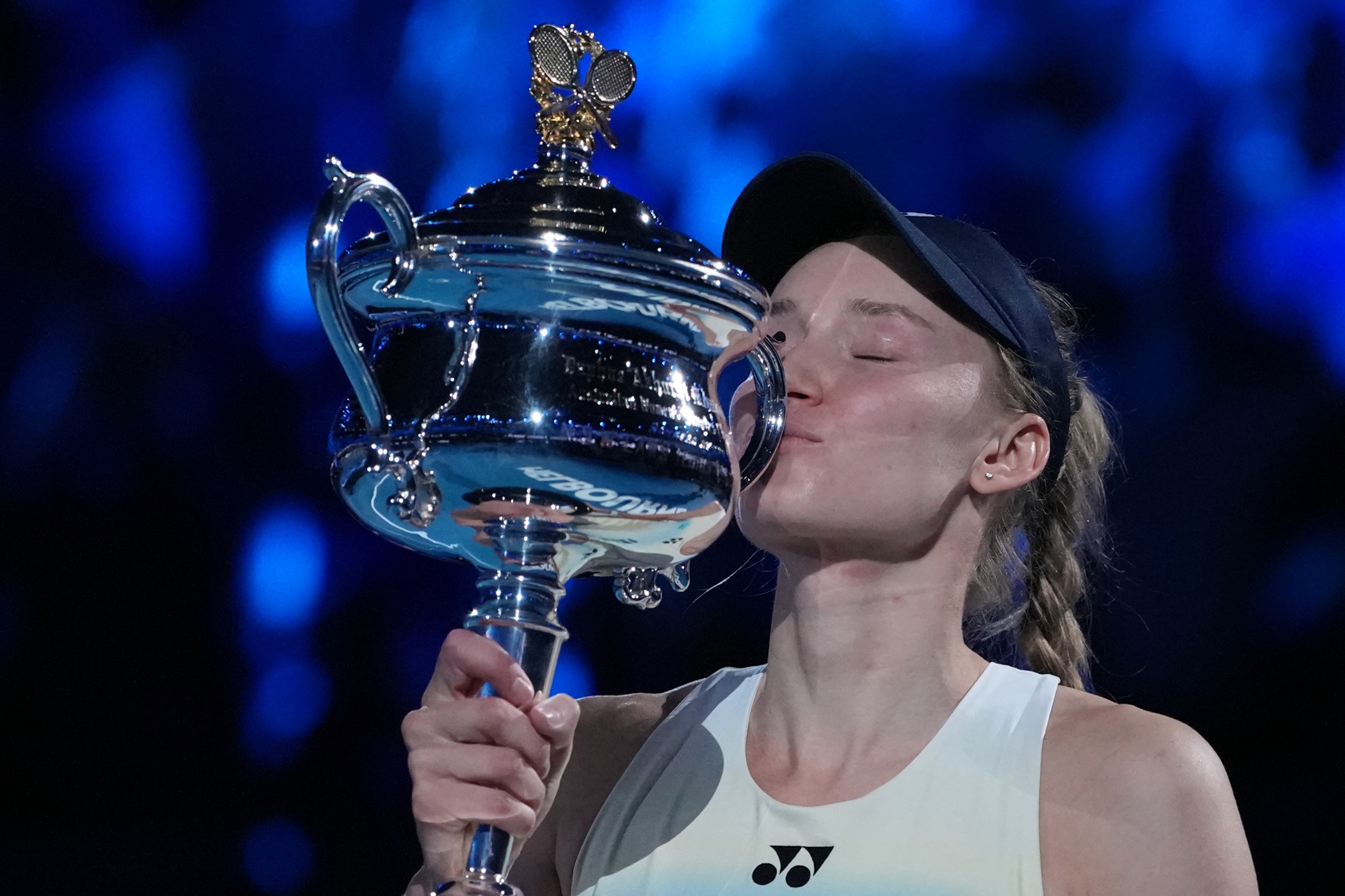 Elena Rybakina of Kazakhstan kisses the Daphne Akhurst Memorial Cup after defeating Aryna Sabalenka of Belarus to win the women