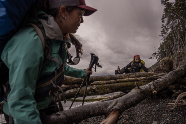 Members of the Cape Froward expedition group hike more than 5 miles from Cruz de los Mares to Río Nodales, dodging and climbing fallen trees that have blocked the path between the forest and the ocean, on Nov. 3, 2024.