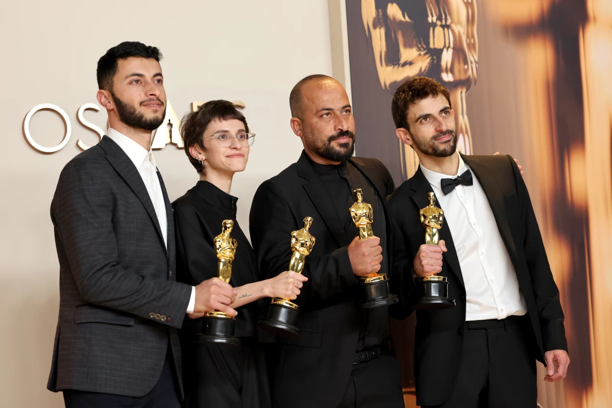 From left: Basel Adra, Rachel Szor, Hamdan Ballal and Yuval Abraham pose with their Oscar awards for best documentary for the film No Other Land in the press room at the 97th Academy Awards in Los Angeles on Sunday.