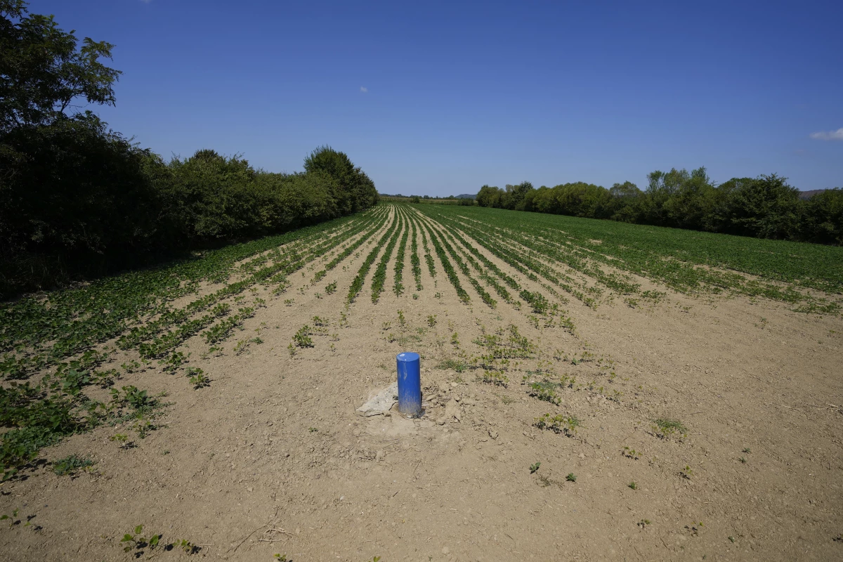 Multinational company Rio Tinto's test drill hole is seen in a field in the Jadar Valley, Serbia, Aug. 6.