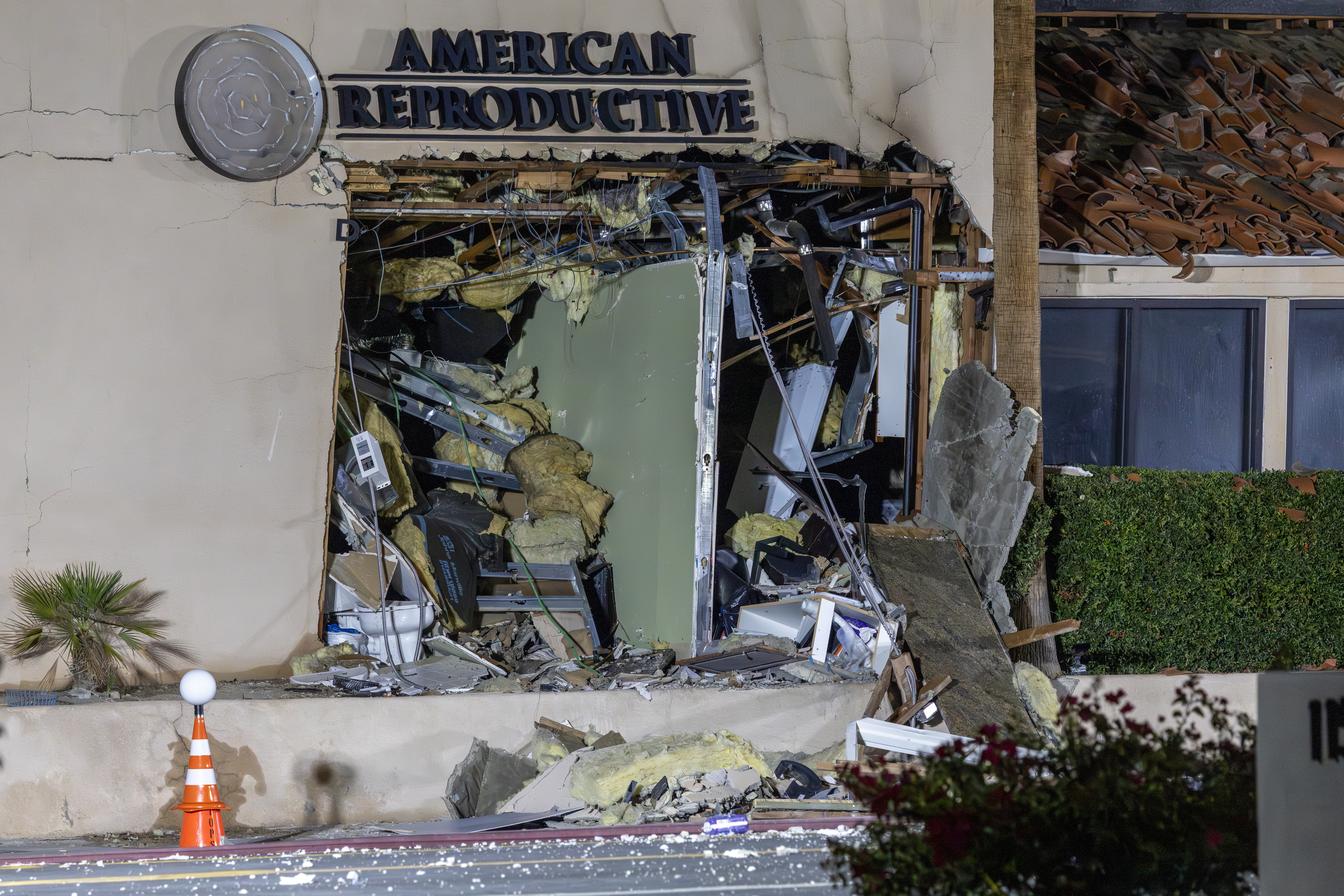 The damaged front of the American Reproductive Centers fertility clinic stands following a bomb blast on May 17 in Palm Springs, California. A suspected bomber is believed to have post a manifesto to social media before the explosion.