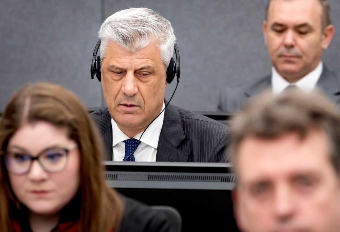 FILE - Former Kosovo president Hashim Thaci, top left, appears before the Kosovo Tribunal as he defends himself against charges including murder, torture and persecution allegedly committed during his country's war for independence from Serbia in the Hague, on April 3, 2023.