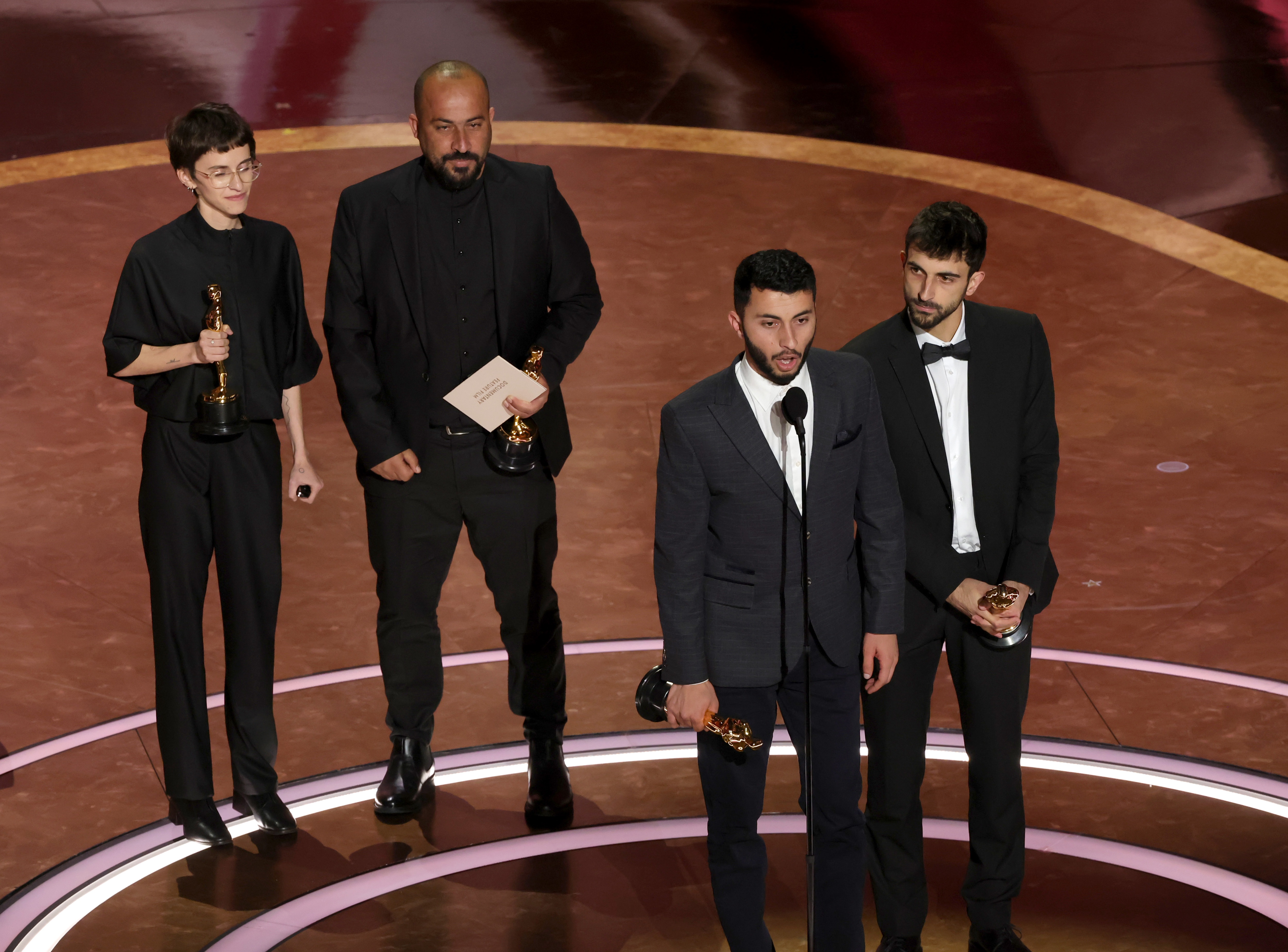 Rachel Szor, left, Hamdan Ballal, Basel Adra and Yuval Abraham accept the Oscar for best documentary feature film for <!-- raw HTML omitted -->No Other Land.<!-- raw HTML omitted -->