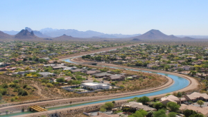 The Central Arizona Project canal winds through Phoenix on March 26, 2026. The 336-mile canal system pumps water from the Colorado River to the Phoenix and Tucson areas. Water supplies for the canal’s users will be cut under a new plan for managing the Colorado River.