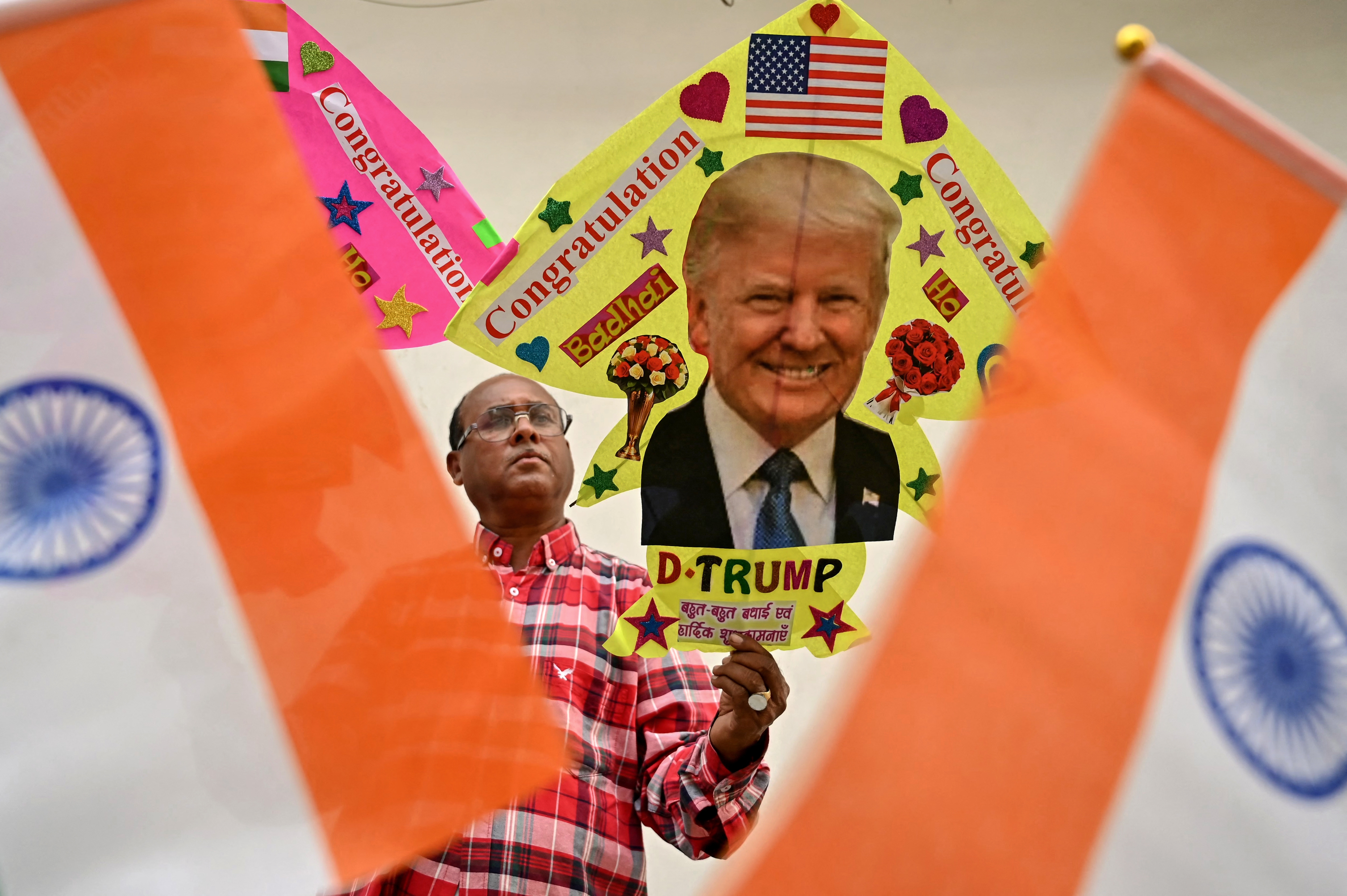 A kite maker in Amritsar, India, displays a kite with an image of Donald Trump on Nov. 6.