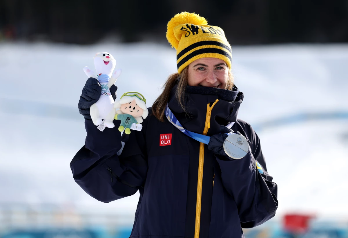 Silver medalist Ebba Andersson of Team Sweden celebrates on the podium during the Medal Ceremony for the Women's 10km + 10km Skiathlon on day one of the Milano Cortina 2026 Winter Olympic games at Tesero Cross-Country Skiing Stadium on Feb. 7 in Val di Fiemme, Italy.