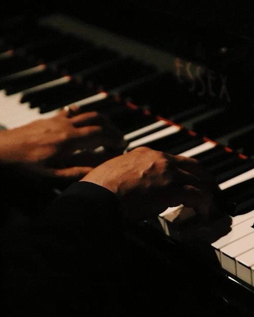 Gerard Gibbs plays the piano during the 'Satin Doll Revue' at Aretha's Jazz Café in Detroit on Monday.