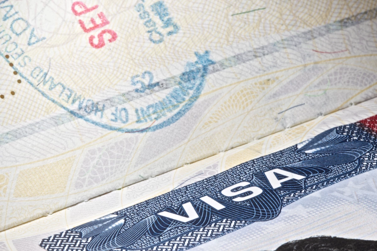 A U.S. visa with a partial stamp.