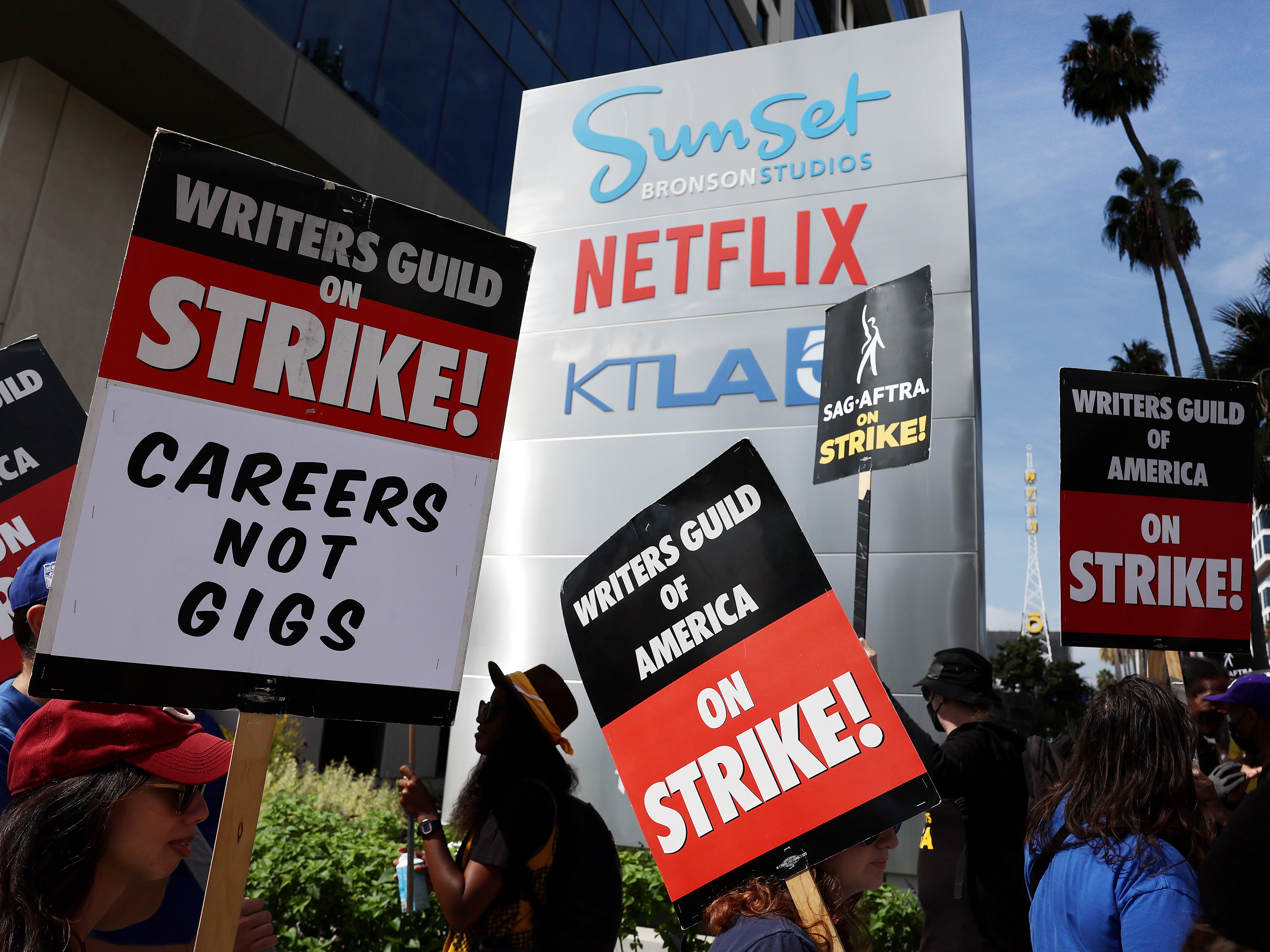 Striking Writers Guild members picket alongside SAG-AFTRA members outside Netflix studios in September 2023.