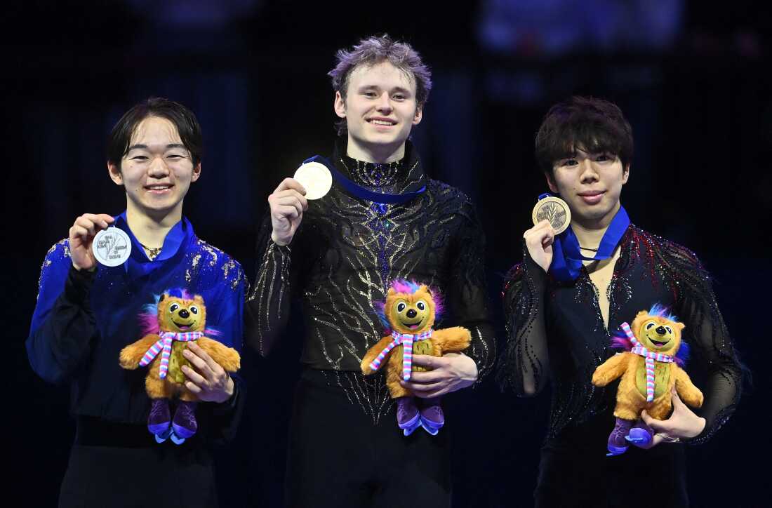 World medalists Yuma Kagiyama, Ilia Malinin and Shun Sato (L-R) celebrate on the podium in Prague, Czech Republic on March 28, 2026. (Photo by Michal Cizek / AFP via Getty Images)