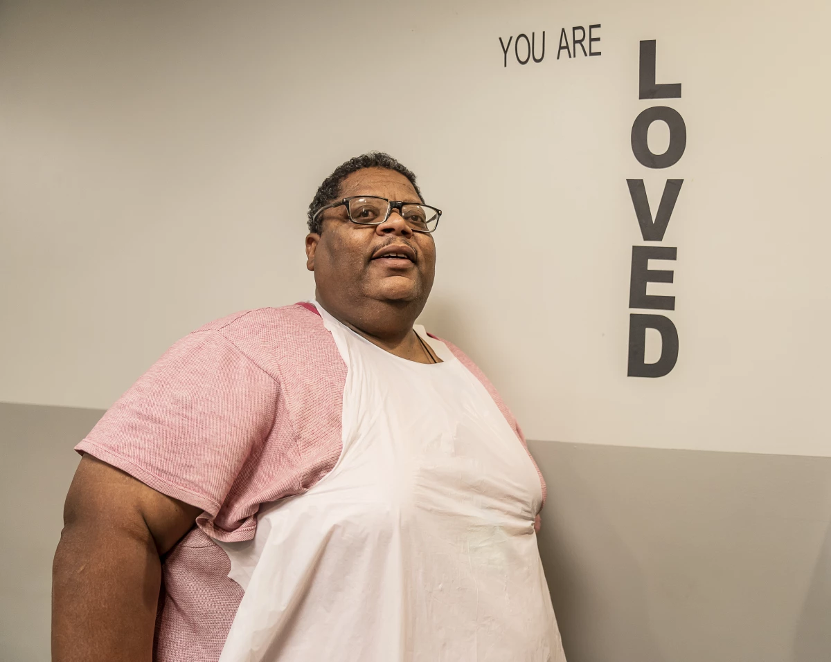 Willie Wiggins, who says he has been homeless for 18 months, volunteers in the mission's kitchen.