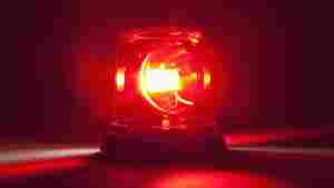 A picture of a red siren light in close up. 