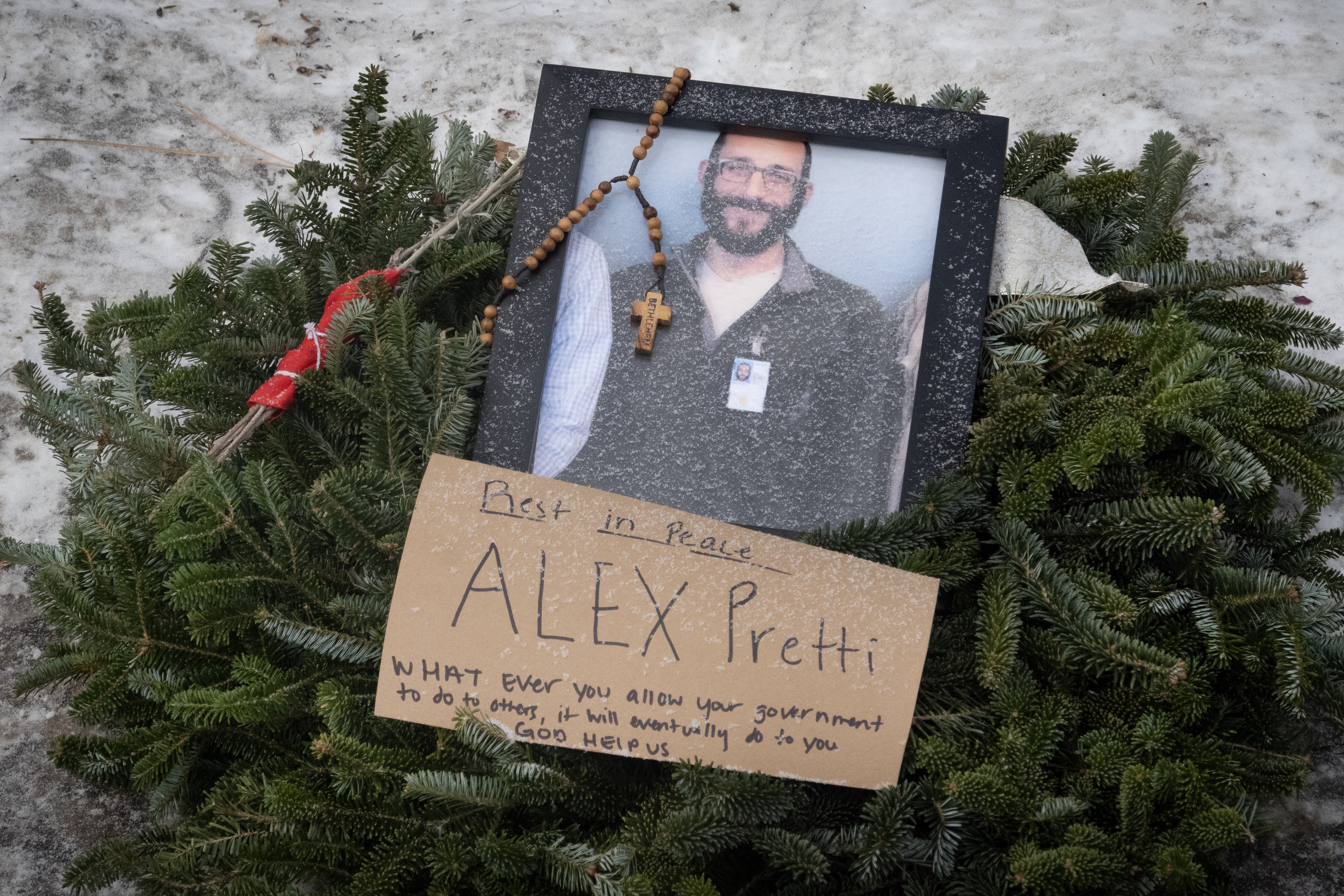 A picture sits at a memorial to Alex Pretti on Jan. 25, 2026 in Minneapolis, Minn.