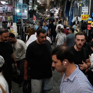 People walk in Tehran's traditional main bazaar, Iran, Saturday, Aug. 8, 2026. 