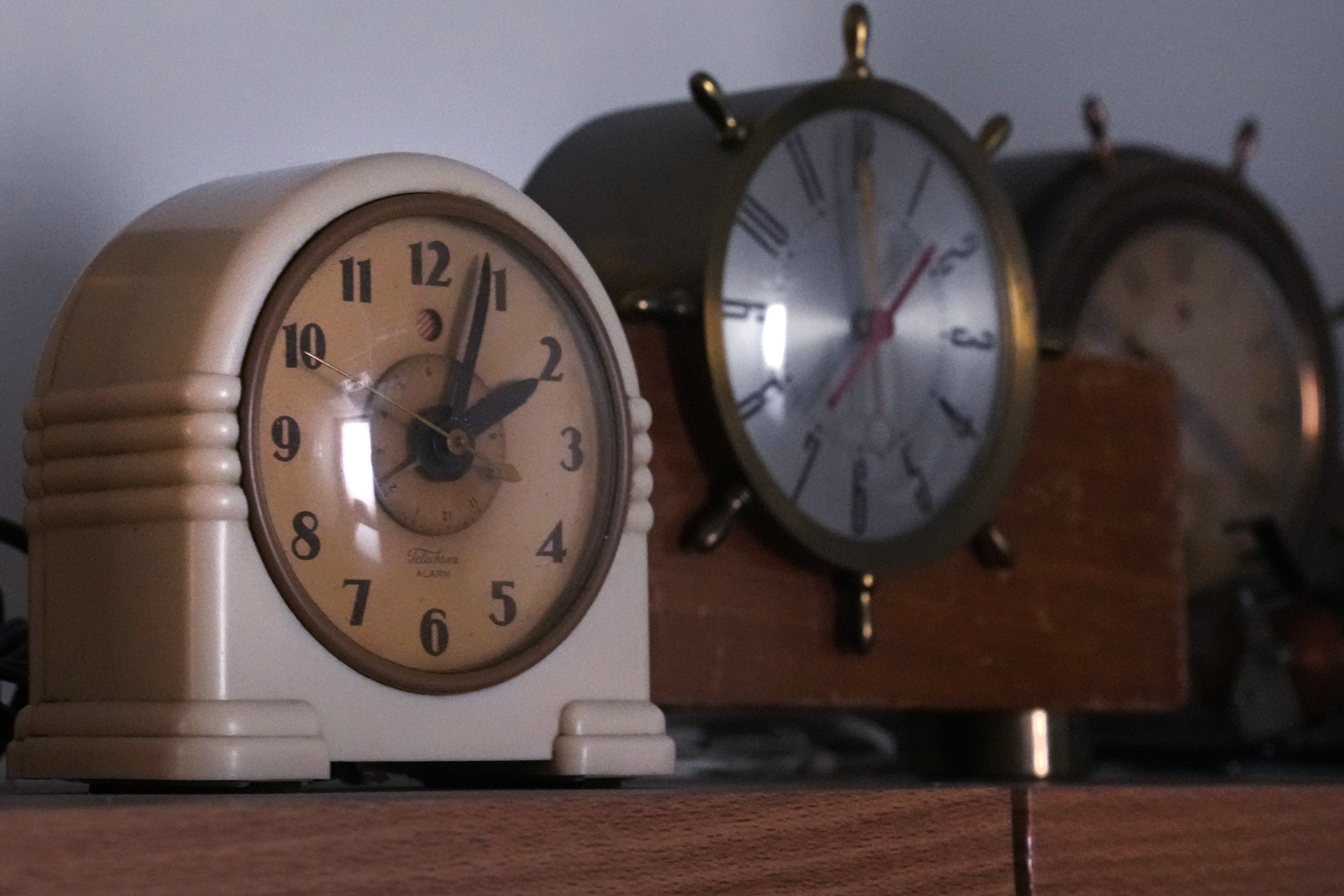 Vintage clocks, seen here at the Electric Time Company in Medfield, Mass., will need a reset to reflect Sunday
