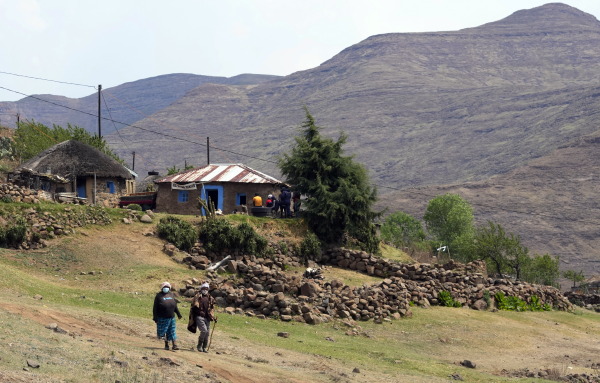 Women leave the polling station after casting their vote in Thaba-Tseka district, Lesotho, on Oct. 7, 2022.