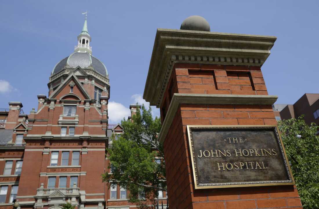 A sign stands in front of part of the Johns Hopkins Hospital complex in Baltimore. Most medical students at Johns Hopkins University will no longer pay tuition thanks to a $1 billion gift from Bloomberg Philanthropies. Starting in the fall, the gift announced Monday, July 8, 2024 will cover full tuition for medical students from families earning less than $300,000.