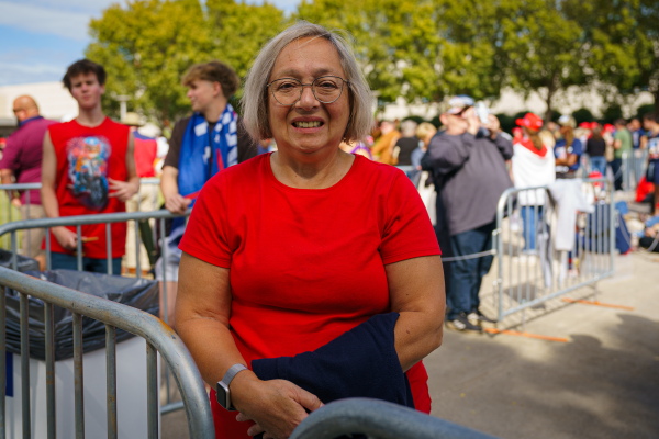 Daniela Usurin waits in line for a Trump campaign rally in Atlanta on Oct. 15, 2024. She says immigration and inflation are driving her vote.