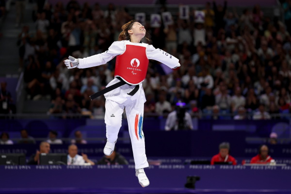 Zakia Khudadadi of the Refugee Paralympic Team, originally from Afghanistan, celebrates after winning the Women's Taekwondo K44 -47kg Repechage contest on August 29.