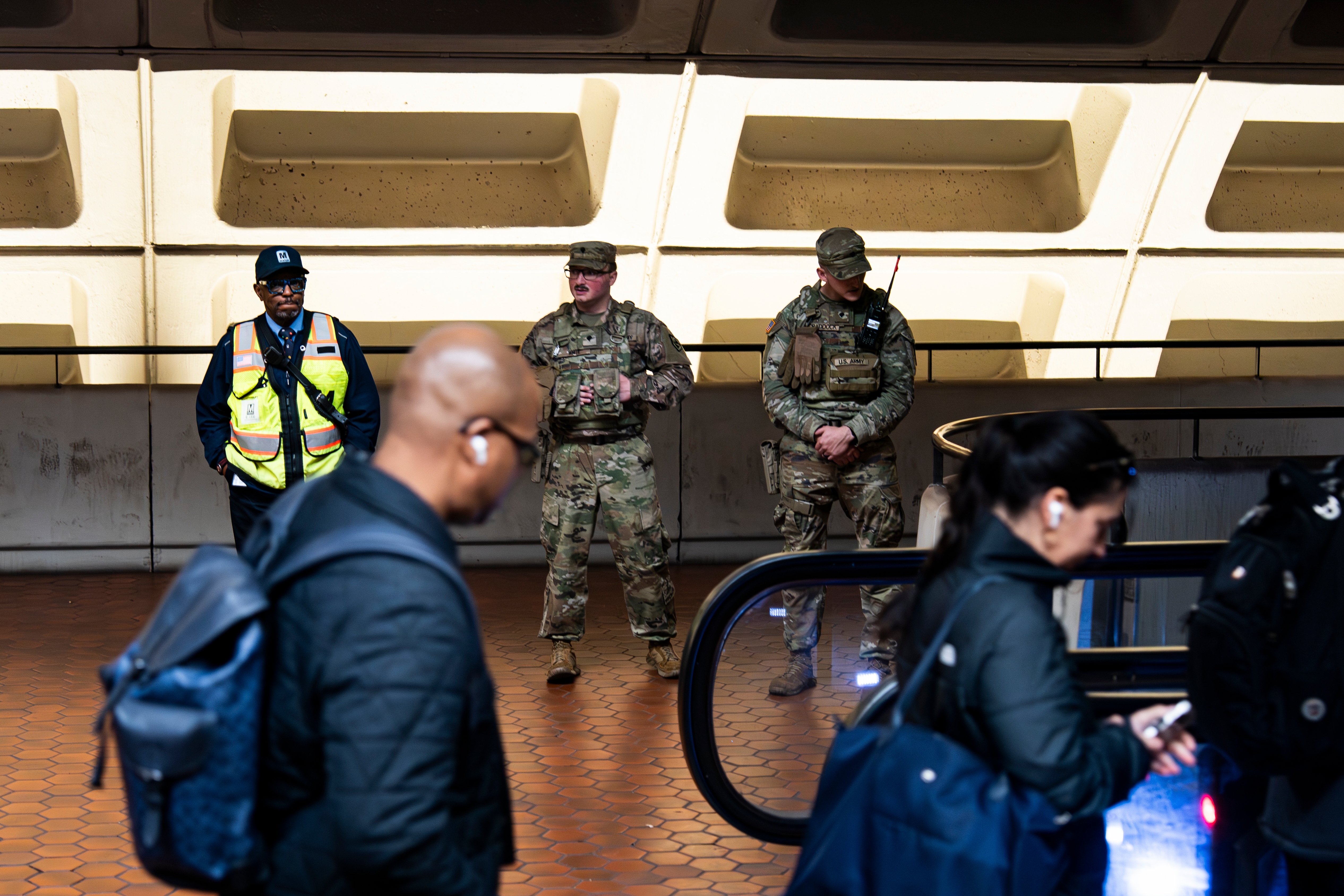 Members of the National Guard stand by an escalator at the Farragut North Metro station in Washington, D.C. on Nov. 13.