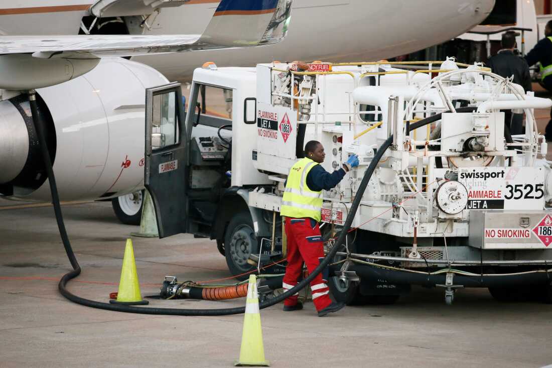 Prices for U.S. jet fuel have nearly doubled since before the Iran war began, shaking up the aviation industry. This file photo shows a worker preparing to fuel a United Express jet at Dallas-Fort Worth International Airport, in Grapevine, Texas.