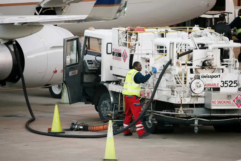 Prices for U.S. jet fuel have nearly doubled since before the Iran war began, shaking up the aviation industry. This file photo shows a worker preparing to fuel a United Express jet at Dallas-Fort Worth International Airport, in Grapevine, Texas.