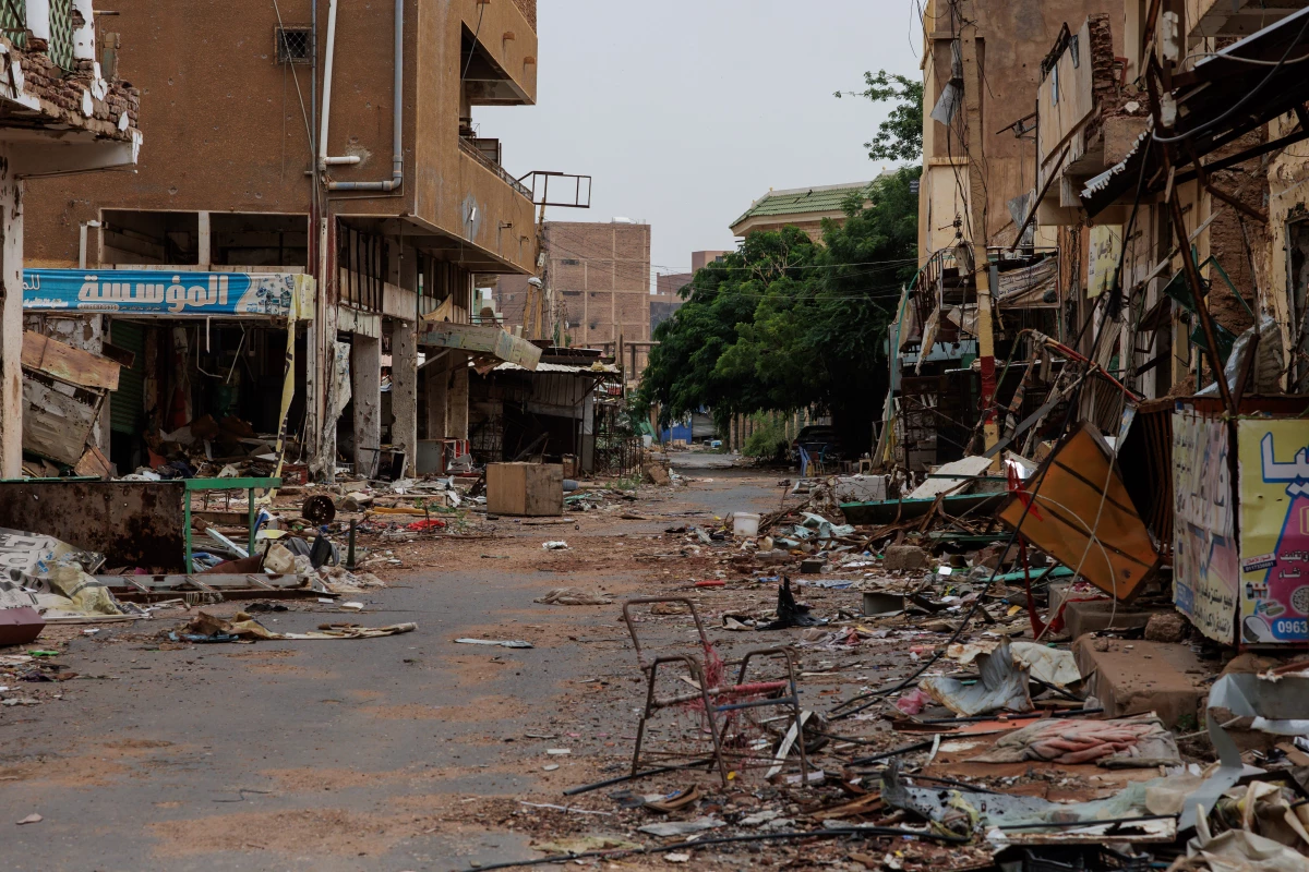 A street running through the Souq Omdurman market is strewn with debris from fighting, in Omdurman, Sudan, on Sept. 7.
