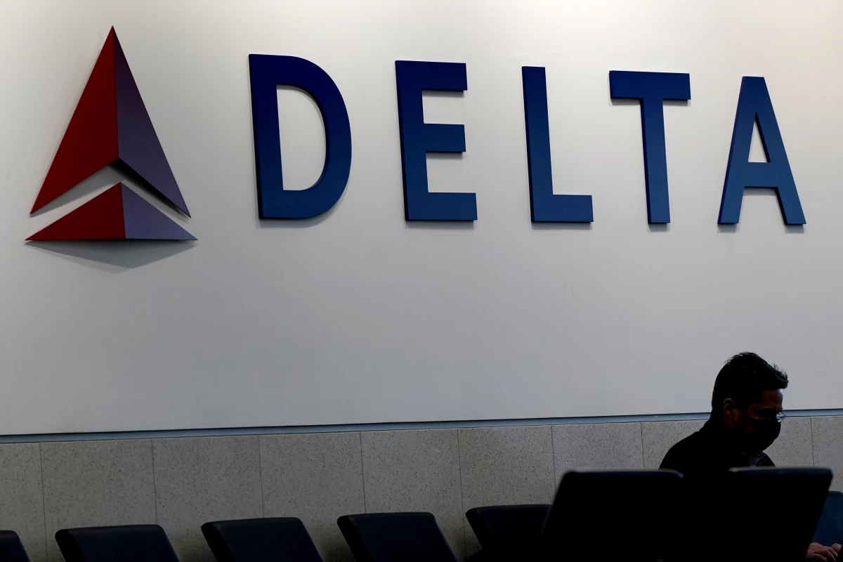 A Delta aircraft clipped the tail of another plane on the tarmac Tuesday morning at Hartsfield-Jackson Atlanta International Airport, officials said. Here, a man is shown waiting for a Delta flight at Hartsfield-Jackson on Jan. 7, 2022.