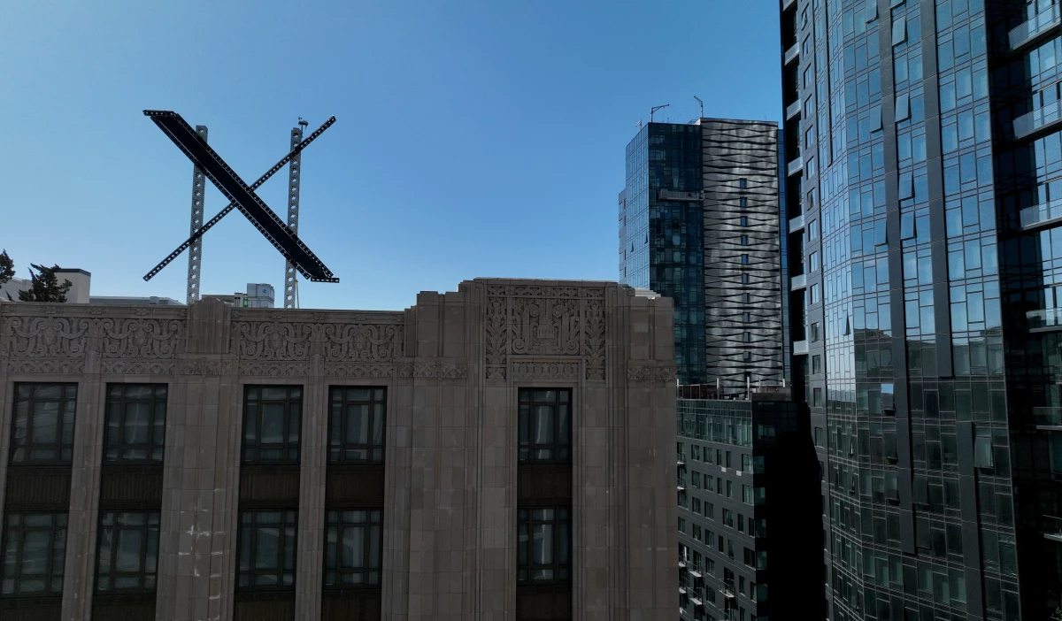 A large X logo on the roof of X (formerly Twitter) headquarters on July 31, 2023, in San Francisco. Musk has since announced that the company's headquarters are moving to Texas.