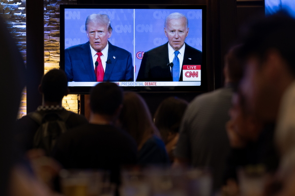 People at the Old Town Pour House watch the presidential debate on June 27, 2024 in Chicago. President Joe Biden's poor performance led to his decision to withdraw from the race.