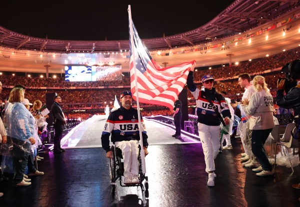 Ellie Marks and Paul Schulte hold Team USA's flag during the closing ceremony of the Paris 2024 Summer Paralympic Games at Stade de France on September 08, 2024 in Paris, France. (Photo by Ezra Shaw/Getty Images)