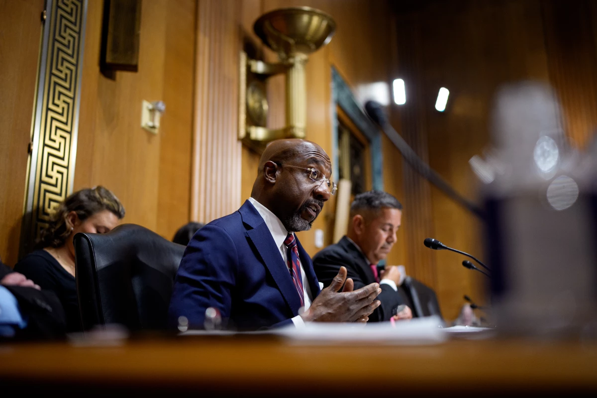 Sen. Raphael Warnock, D-Ga., speaks as Health and Human Services Secretary Robert Kennedy Jr. appears before a Senate Finance Committee hearing at the Dirksen Senate Office Building on September 04 in Washington, D.C.