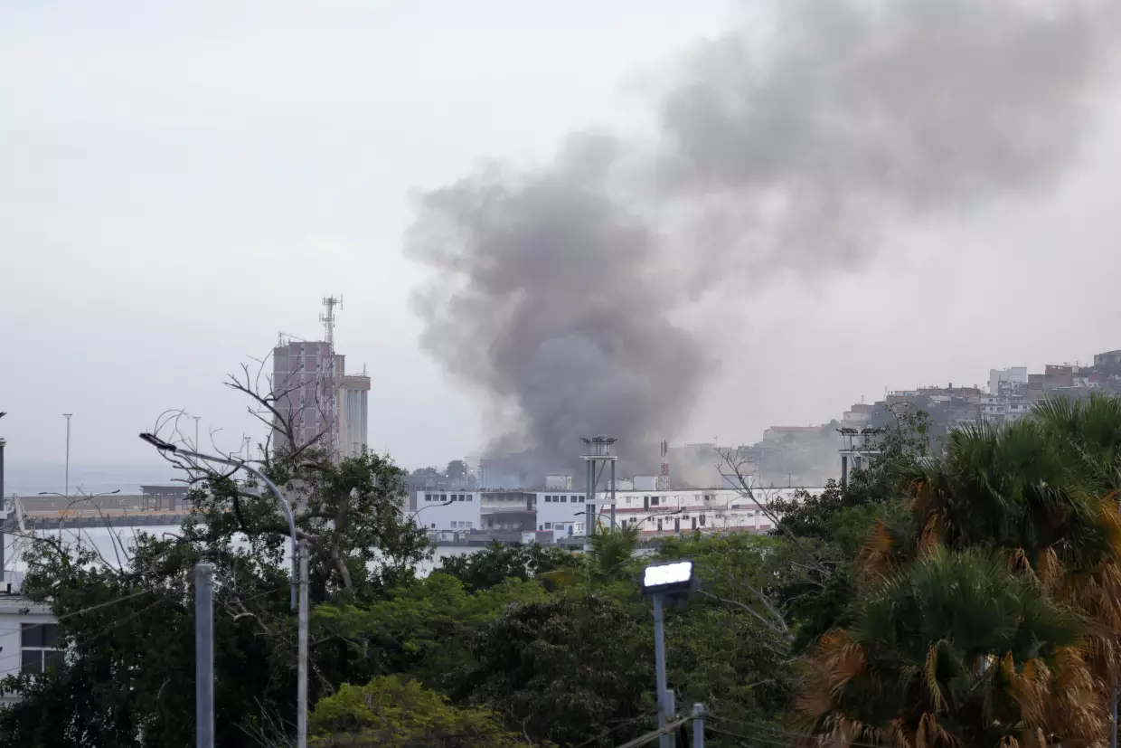 Smoke rises from Port of La Guaira in Venezuela on Jan. 3, 2026 after U.S. forces seized the country's president, Nicolas Maduro, and his wife.