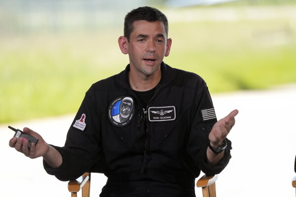 Jared Isaacman speaks at a news conference at the Kennedy Space Center in Cape Canaveral,‍ Fla.