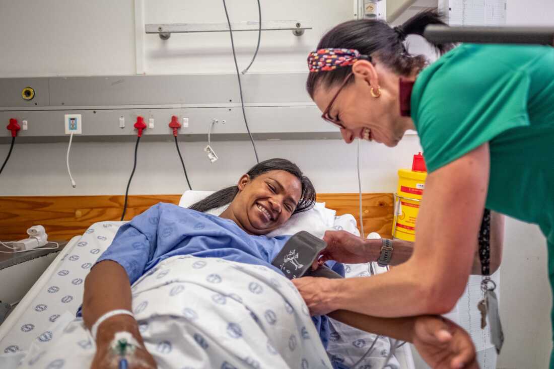 Research nurse Jacqui Thake takes a patient's blood pressure reading at Tygerberg Hospital in Cape Town, South Africa. Thake is part of a team of researchers trialling a possible new treatment for pre-eclampsia, a potentially fatal condition that can affect pregnant mothers and their babies.