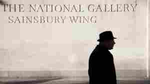 A person walks by the Sainsbury Wing of the National Gallery, London.