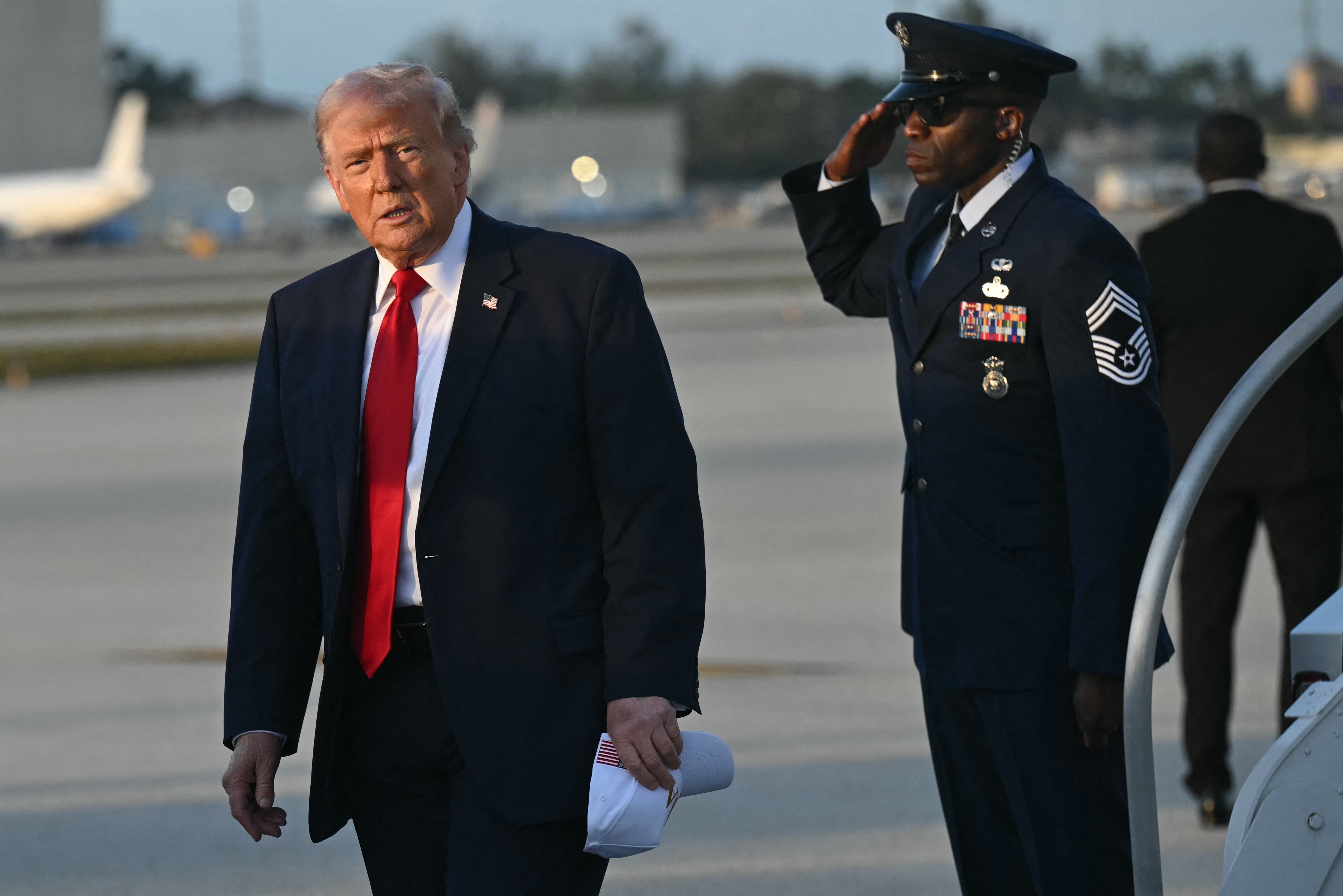 President Trump disembarks from Air Force One upon arrival at Miami International Airport in Miami on March 7.