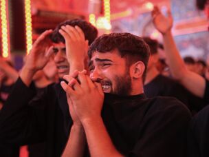 A young pilgrim weeps as he takes part in mourning rituals inside the Imam Hussein Shrine in Karbala during the Arbaeen commemoration.