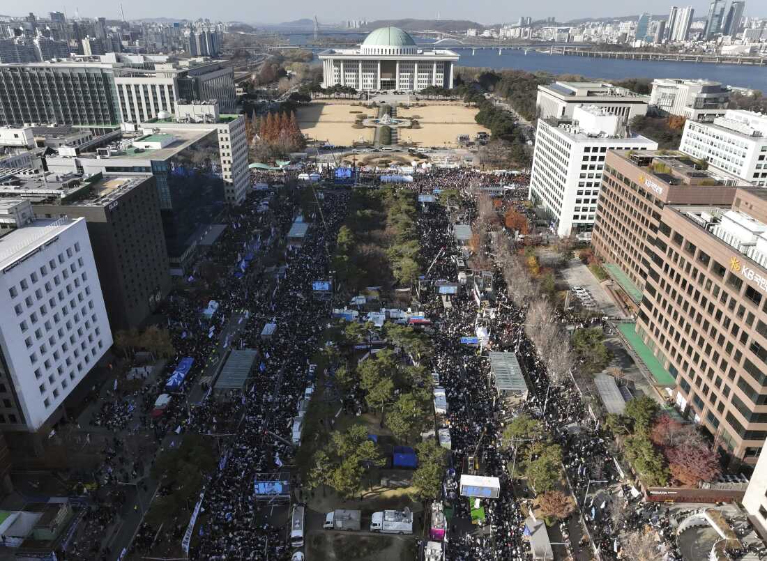 Participants gather during a rally to demand South Korean President Yoon Suk Yeol's impeachment outside the National Assembly in Seoul, South Korea, on Saturday.