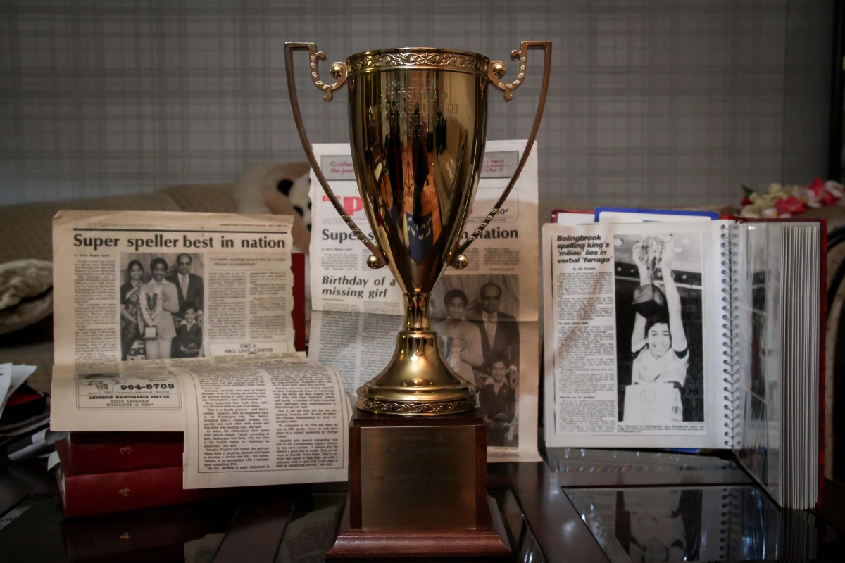 Balu Natarajan won the Scripps National Spelling Bee in 1985. Shown are his trophy and newspaper clippings detailing his win.