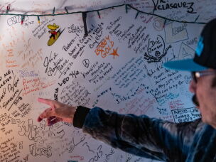 Richard Segovia points to notes musicians have left over the years in his house in San Francisco in April.