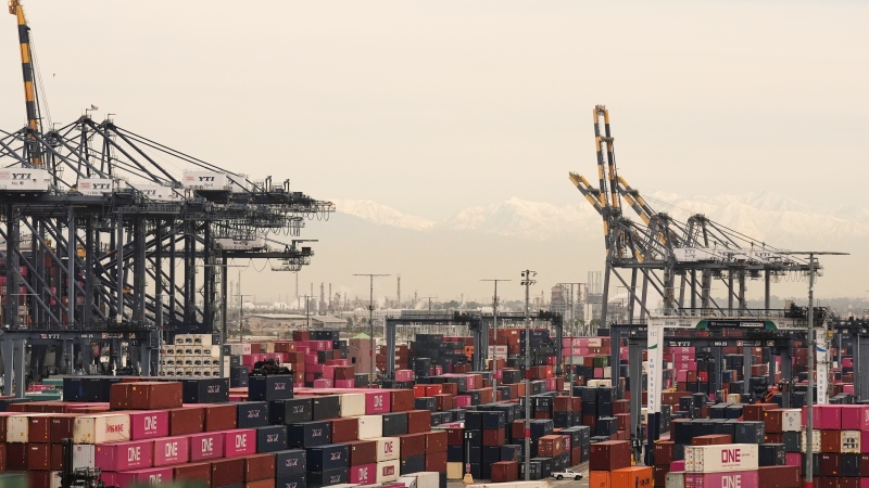 Containers are stacked at the Port of Los Angeles Friday, Feb. 20, 2026, in Los Angeles.