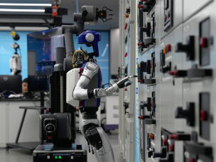 Artificial Intelligence robots demonstrate working on power grid control units during a media organized tour at Guangdong Power Grid Robotics Laboratory in Guangzhou, in southern China's Guangdong province, on April 16.