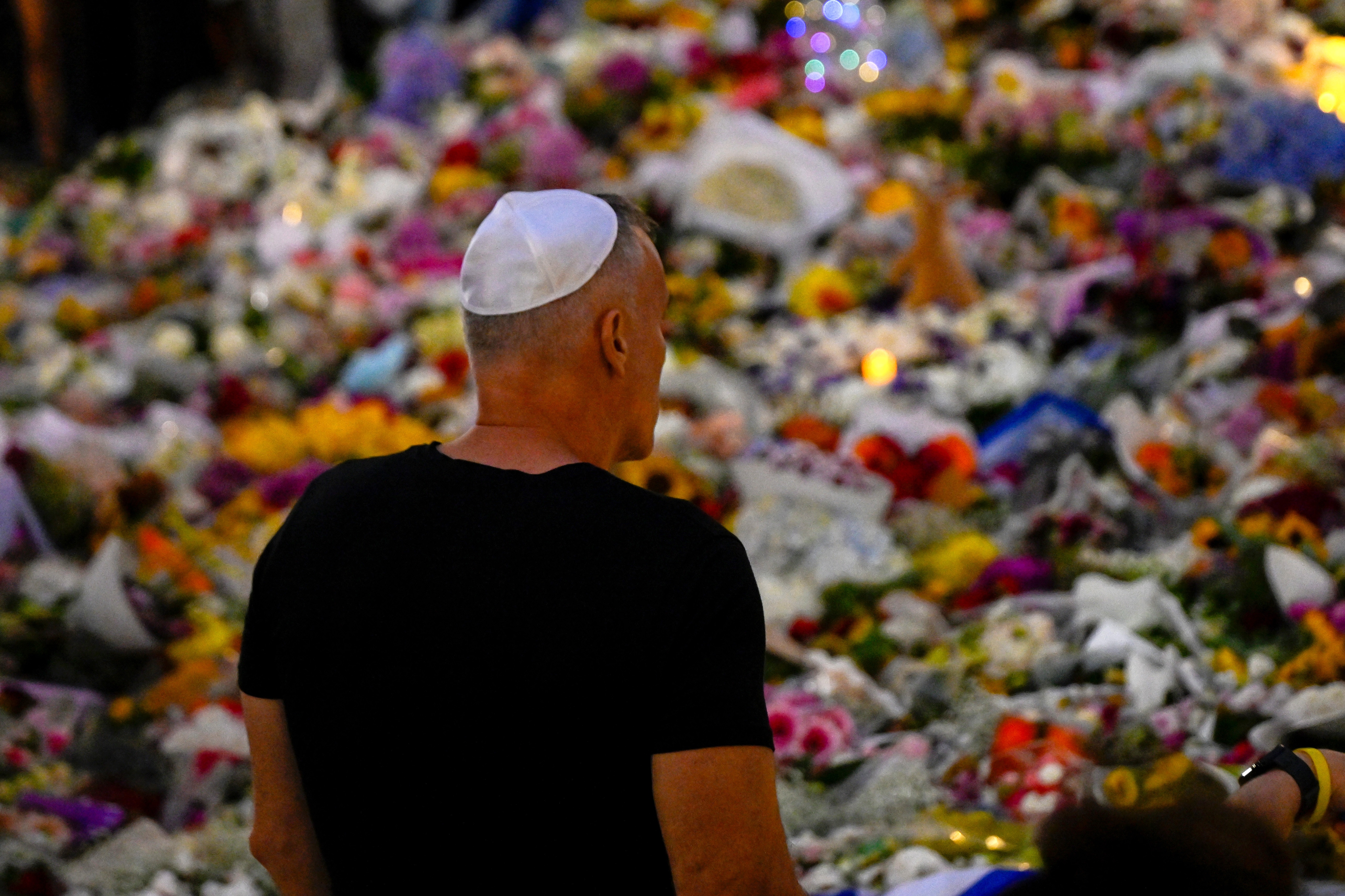 Mourners gather at the Bondi Pavilion as people pay tribute to the victims of a mass shooting at Bondi Beach.