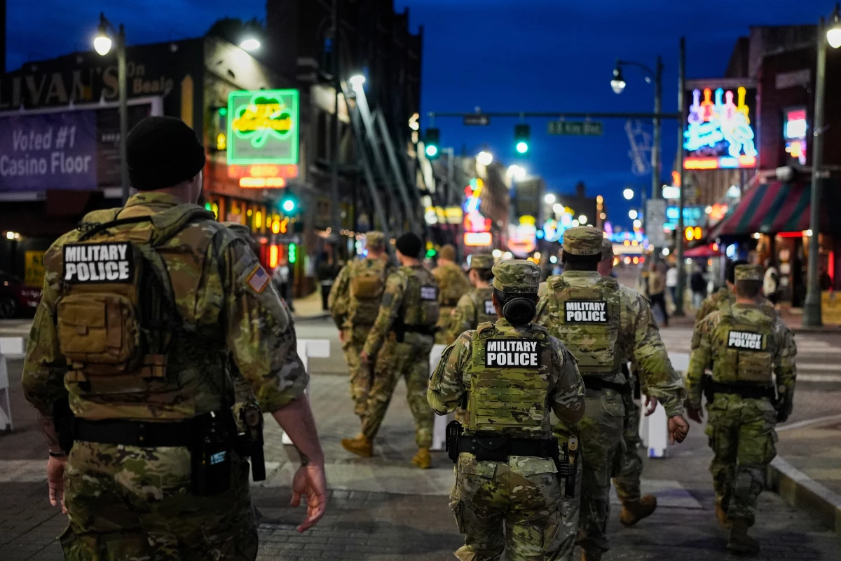 Members of the National Guard patrol along Beale Street, Oct. 24, in Memphis, Tenn. Missouri Gov. Mike Kehoe recently authorized members of his state National Guard to assist immigration agents with clerical and logistical tasks.