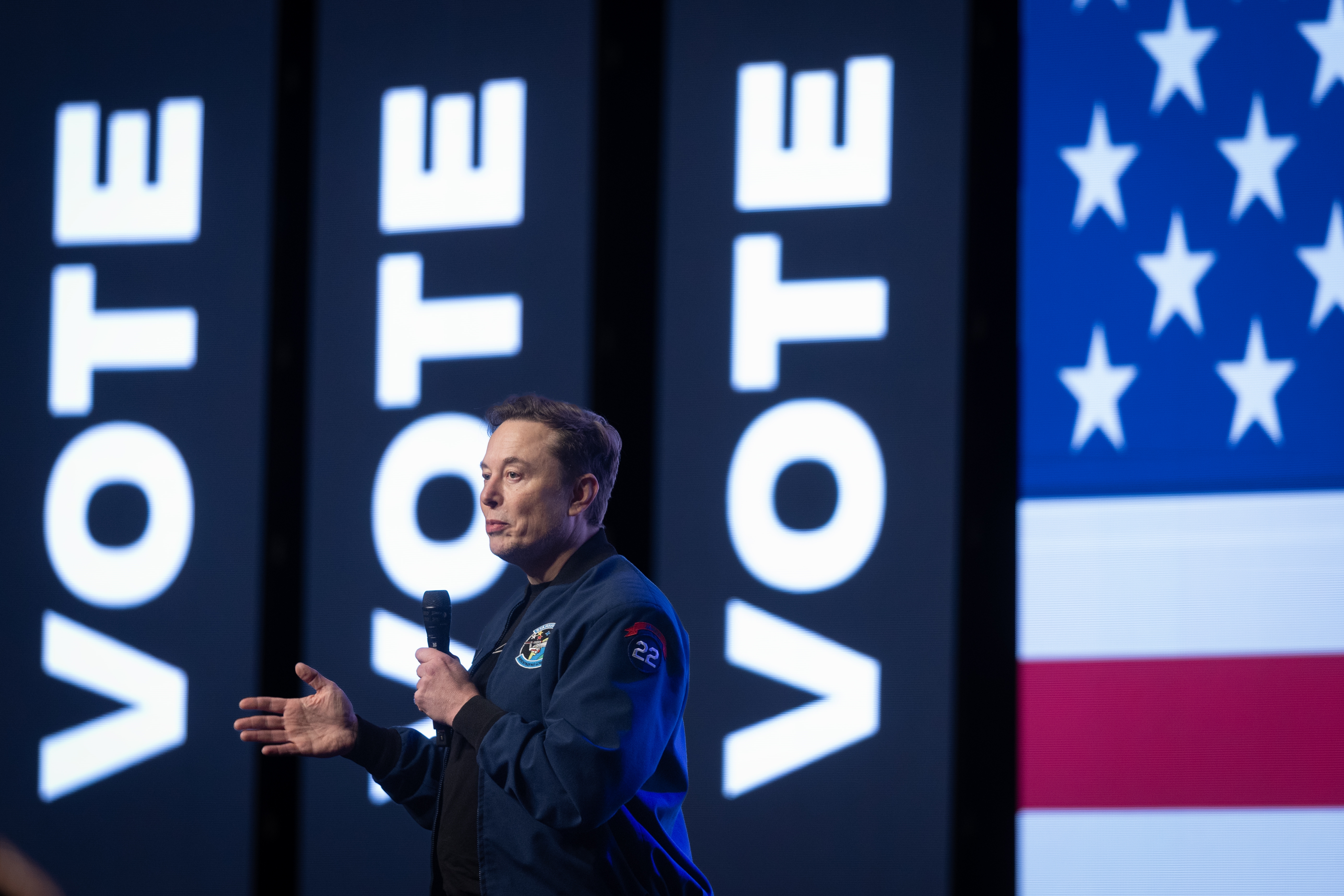 Elon Musk speaking during a town hall meeting on March 30, 2025 in Green Bay, Wisc. ahead of a state Supreme Court election where he invested millions of dollars, only to see his preferred candidate lose. The billionaire announced on Tuesday that he planned to spend less on politics going forward.